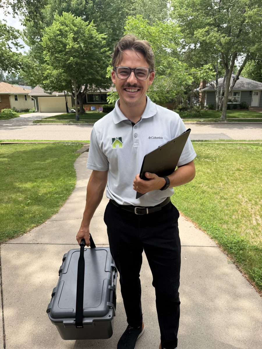 Hunter arriving at a Twin Cities home with radon testing equipment